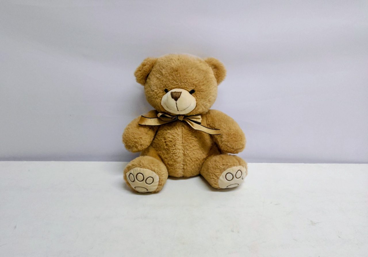 Urso de Pelúcia Marrom Com Laço Dourada (Chá Baby)  - BB Festas Aluguel 