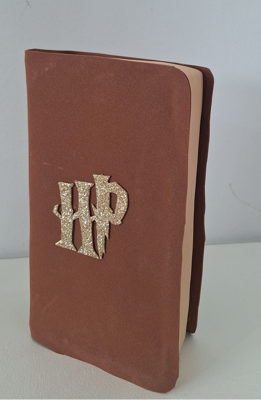 Livro Herry Potter - SonikaDecoracaohttps://wa.me/message/Q2BS5PB4ZSIYH1